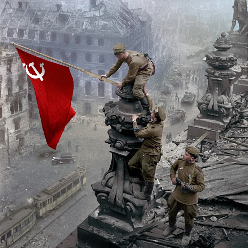 the-soviet-banner-of-victory-raised-by-the-red-army-soldiers-on-the-reichstag-building-in-berlin-on-may-1-1945-photo-by-yevgeni-khaldei-.jpg